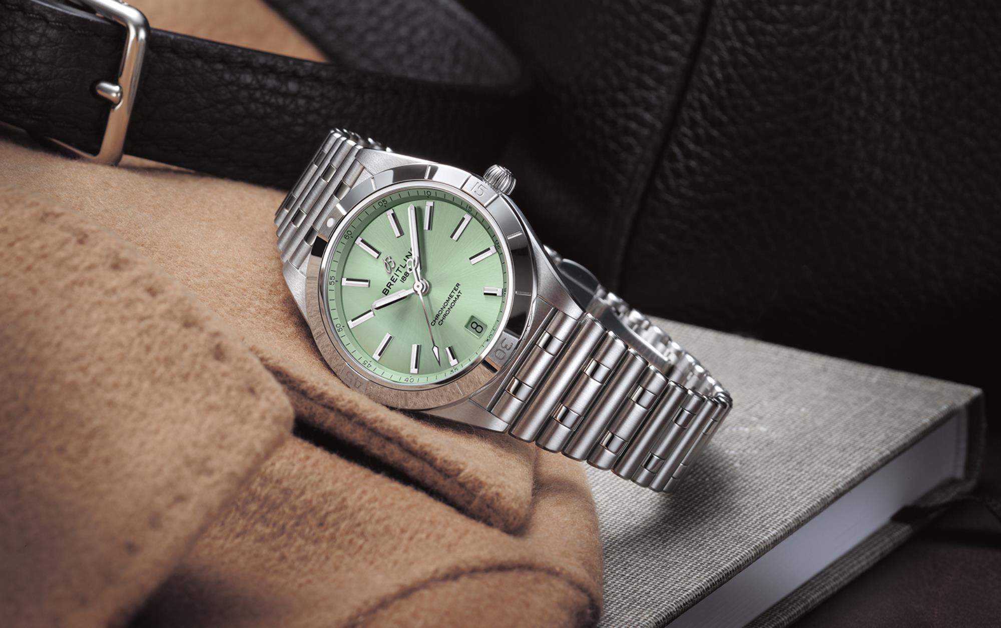 The mint green dial fake watch has a date window.