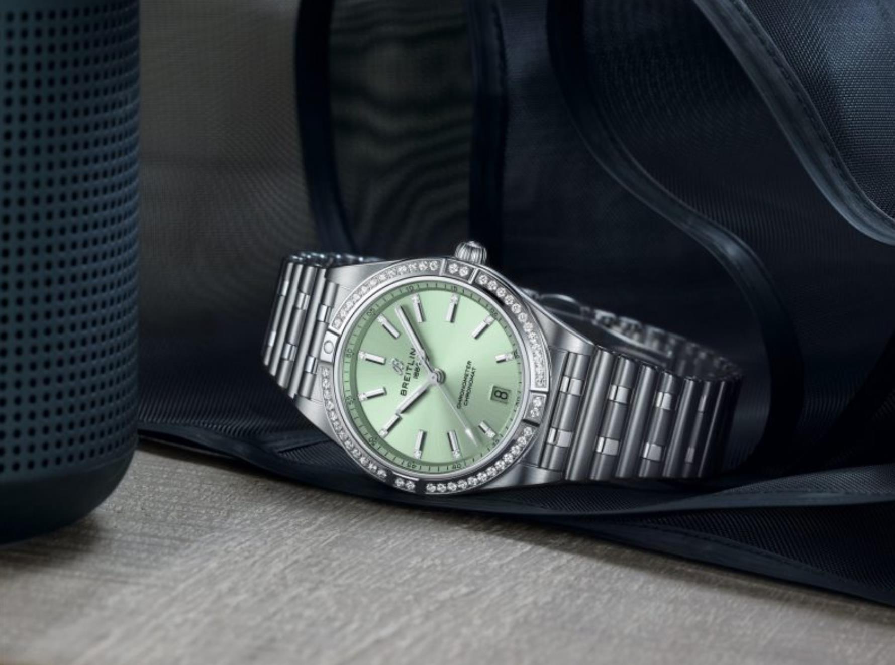 The stainless steel fake watch is decorated with diamonds.