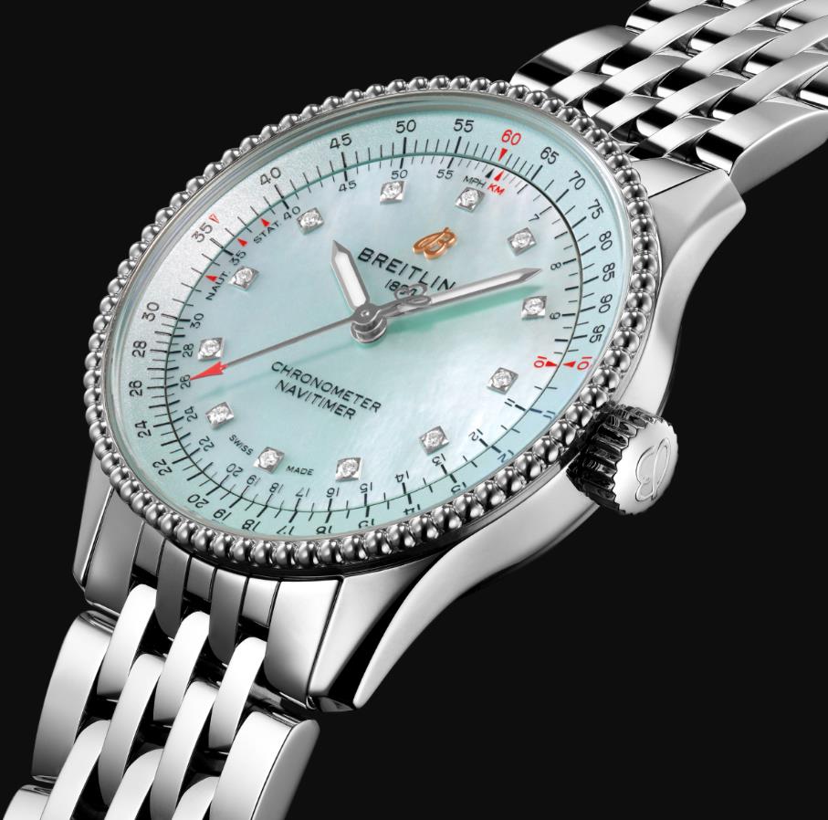 The light blue dial fake watch has diamond hour marks.